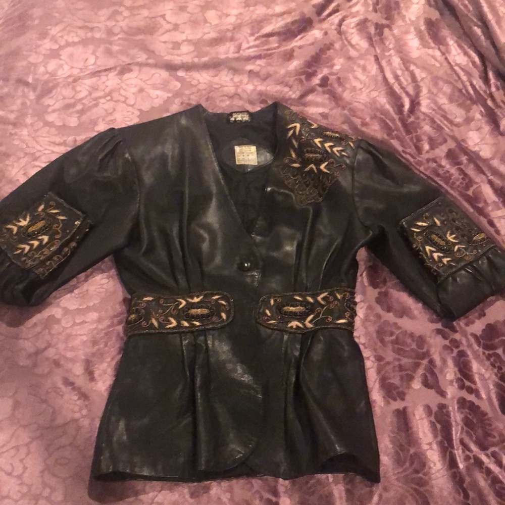 100% vintage leather jacket.